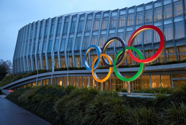 FILE PHOTO: The Olympic rings are pictured in front of the International Olympic Committee (IOC) in Lausanne, Switzerland, December 7, 2020. REUTERS/DENIS BALIBOUSE/FILE PHOTO