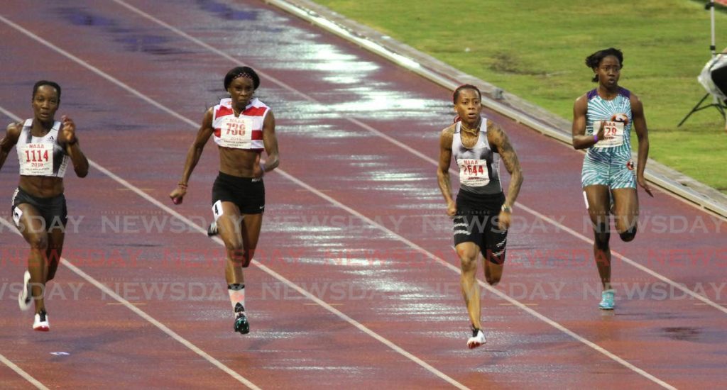 Michelle-Lee Ahye (second from right) sprinting to victory in the 2019 National Open Championships women's 100-metre final at the Hasely Crawford Stadium, Mucurapo. PHOTO BY ANGELO MARCELLE. - Angelo Marcelle