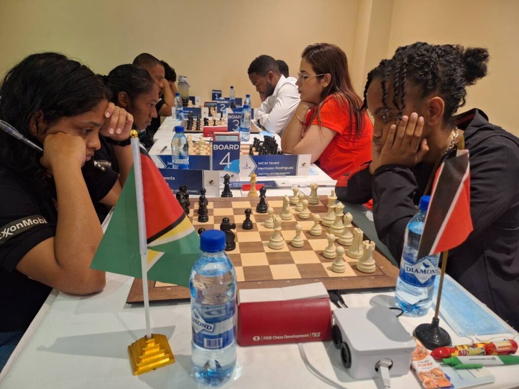 TT's chess team engage in competitive action against Guyana at the inaugural Caricom Classic in Guyana. Zara La Fleur (right foreground) plots her next move. Photo courtesy TT Chess Association. - (Image obtained at newsday.co.tt)
