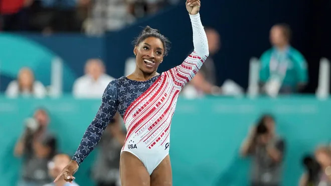 Simone Biles of the United States holds up the number one after the women’s team final at the Paris 2024 Olympic Summer Games at Bercy Arena on July 30, 2024. Kyle Terada, USA TODAY Sports (Image obtained at usatoday.com)