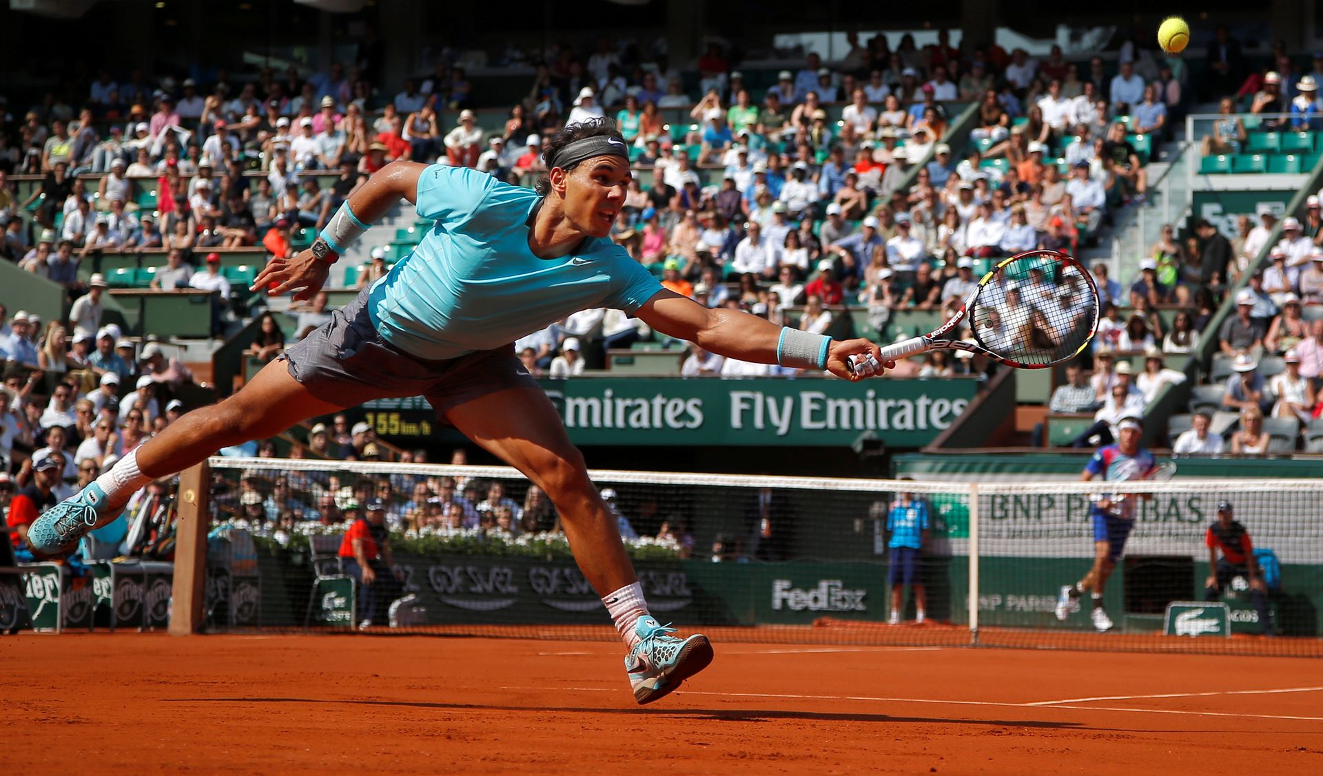 FILE - Spain's Rafael Nadal returns the ball during the third round match of the French Open tennis tournament against Argentina's Leonardo Mayer at the Roland Garros stadium, in Paris, France, Saturday, May 31, 2014, as he has announced he will retire from tennis at age 38 following the Davis Cup finals in November. (AP Photo/Michel Euler, File)  Michel Euler (Image obtained at guardian.co.tt)