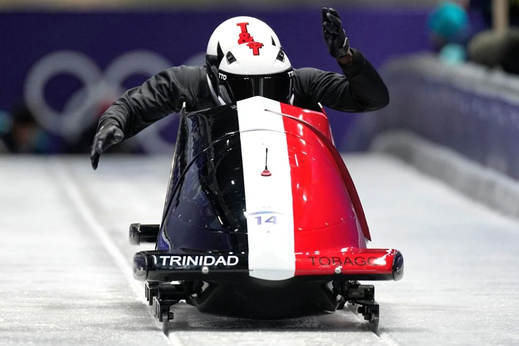 GETTING READY: Trinidad And Tobago’s Axel Brown, takes part in a two-man bobsled training session at the 2026 Winter Olympics, in Cortina d’Ampezzo, Italy, yesterday. —Photo: AP  Aijaz Rahi (Image obtained at trinidadexpress.com)